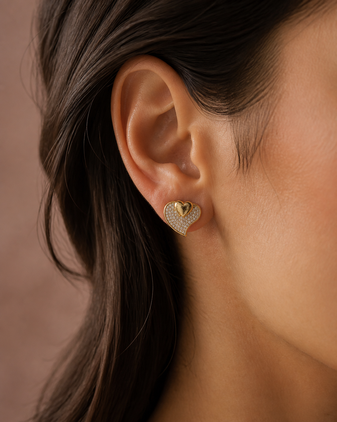 Close side view of an upright Kessia double-heart pave stud earring being worn